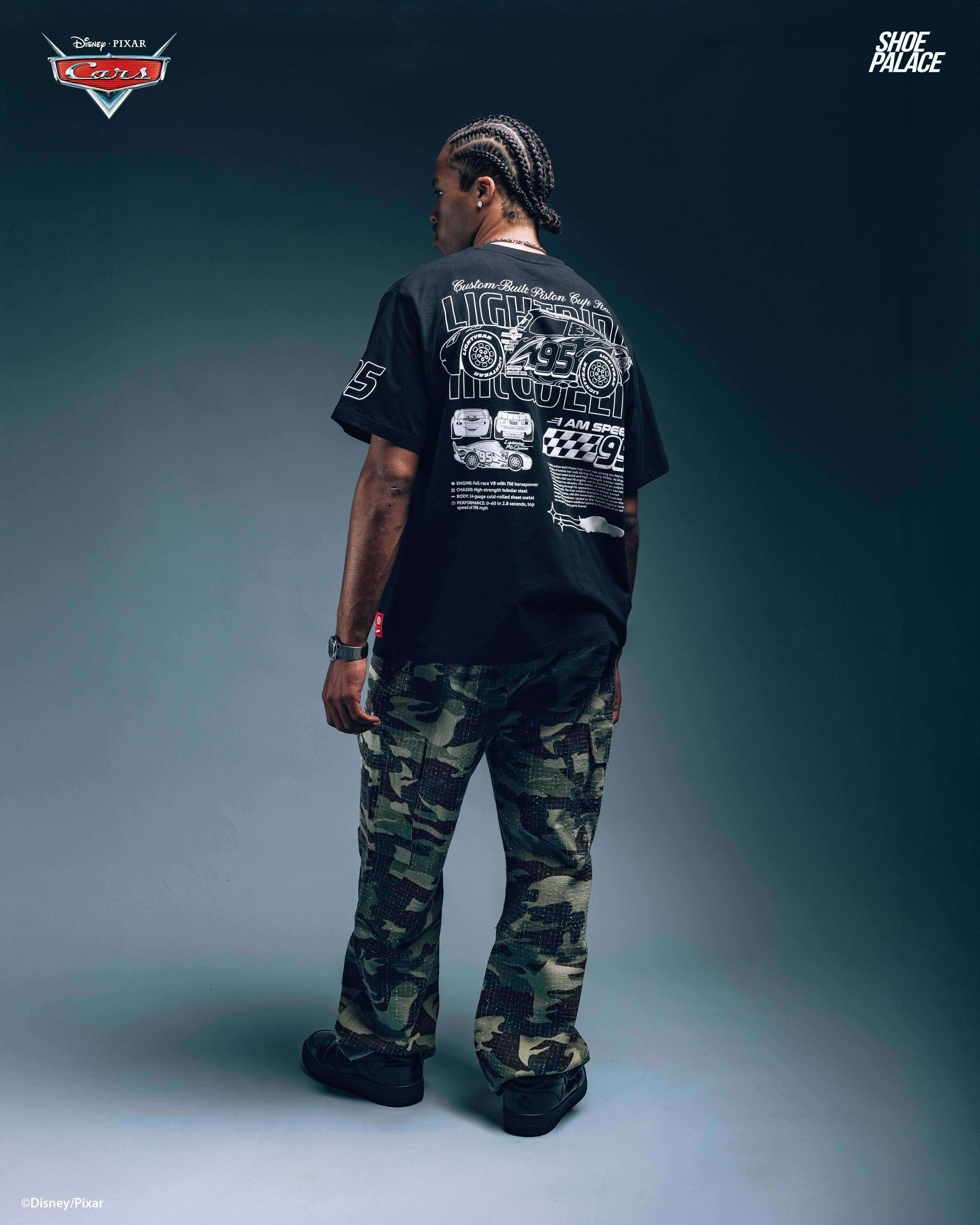 Person wearing a black shirt and camouflage pants, facing away from the camera.