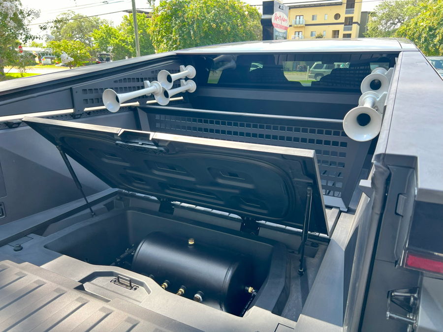 Four white Shocker train horns MOLLE panel driver side bed Tesla Cybertruck 544K gallery photo 8