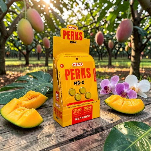A box of Perks product surrounded by mangoes and orchids in an orchard.