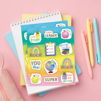 Colorful stickers on a background of notebooks and pens.