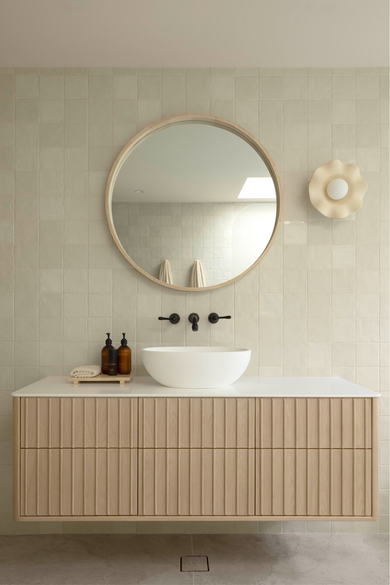 Handmade Ceramic Frill Wall Sconce above a bathroom vanity