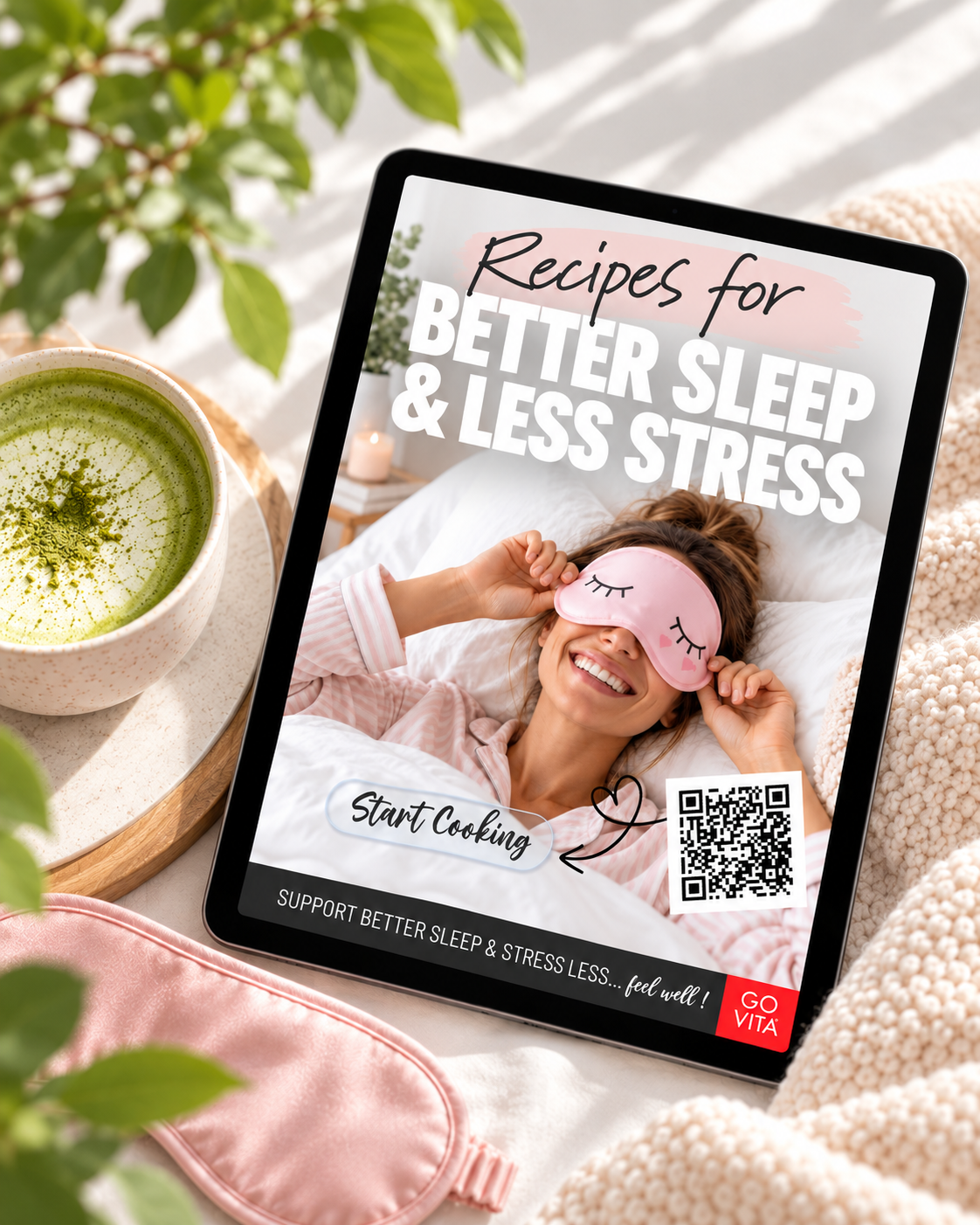A woman in pajamas wearing a sleep mask with a tablet displaying sleep recipes.