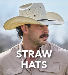 Man wearing a straw cowboy hat with the text 