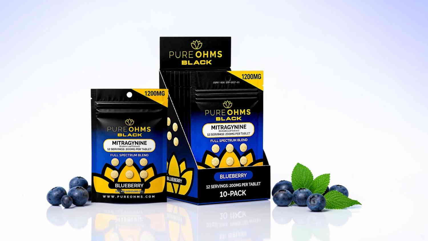 Two packages of dietary supplements with blueberries and green leaves on display.