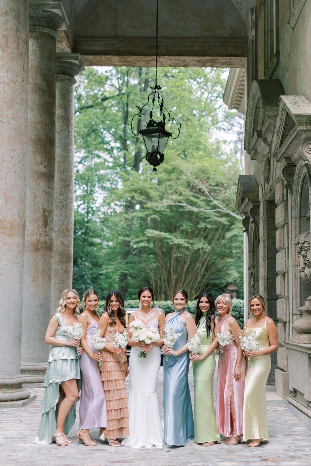 Bride and bridesmaids. holding their flower arrangements