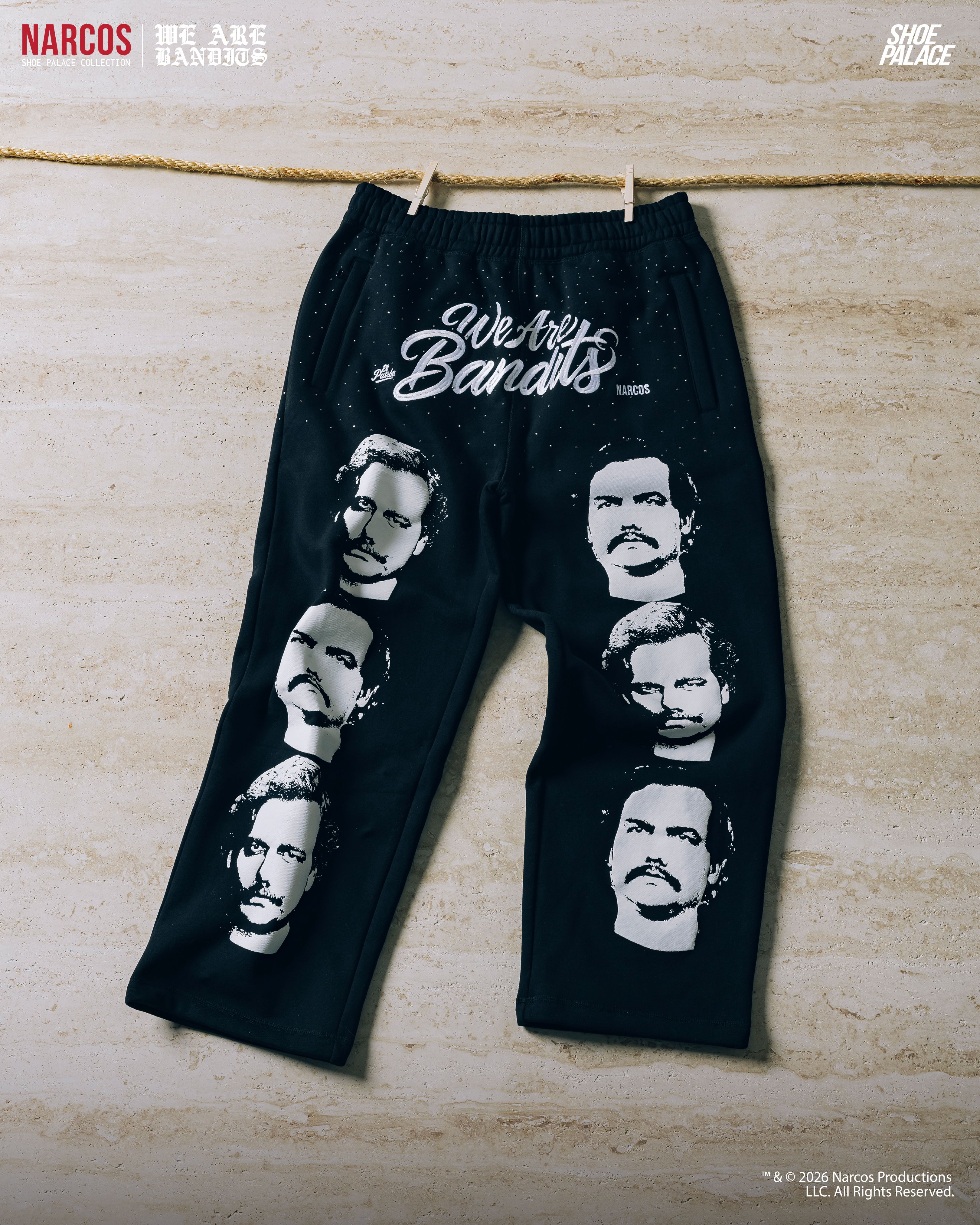 Black pants featuring faces and the text 