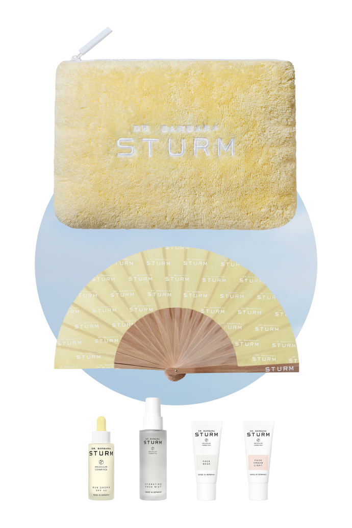 Skincare products with a fan and a yellow pouch.