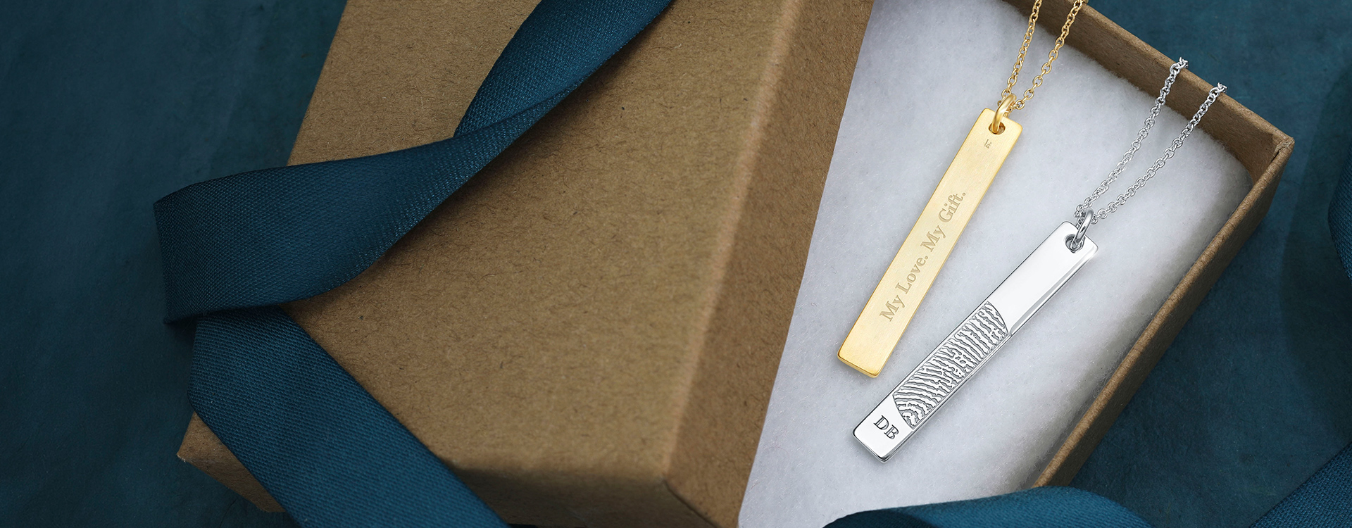 vertical bar pendants engraved with a fingerprint