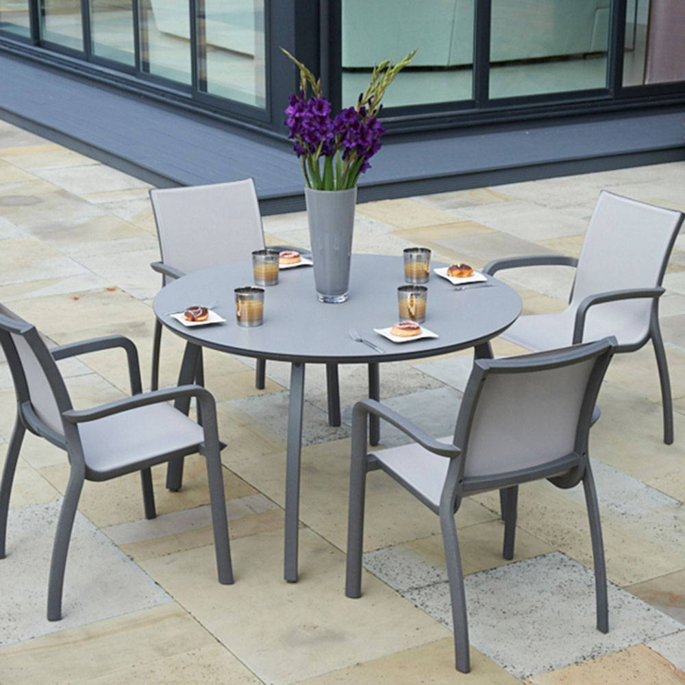Modern grey dining set on a patio.