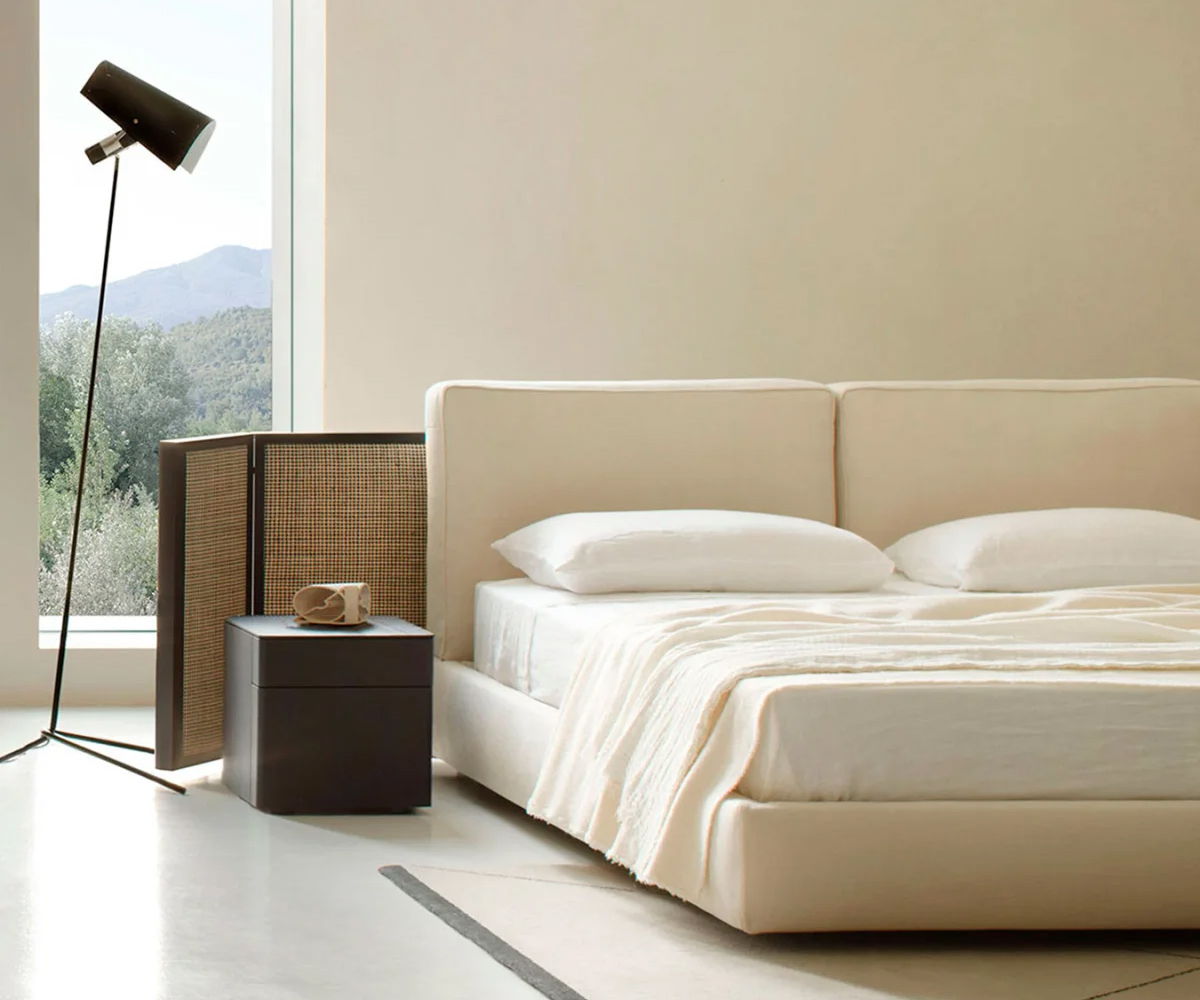 Modern Porro bedroom with a Byron bed, nightstand, and stylish lamp.