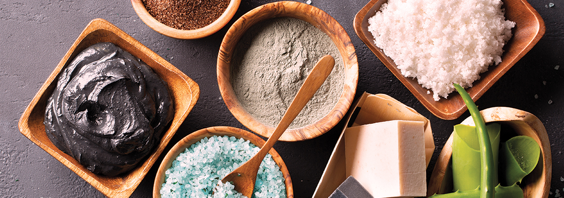 Bowls of various natural ingredients for skincare and beauty treatments.