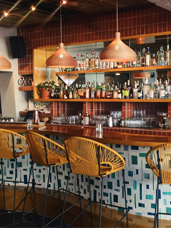Boxhill's Puerto Pub bar stools at a midcentury modern bar.