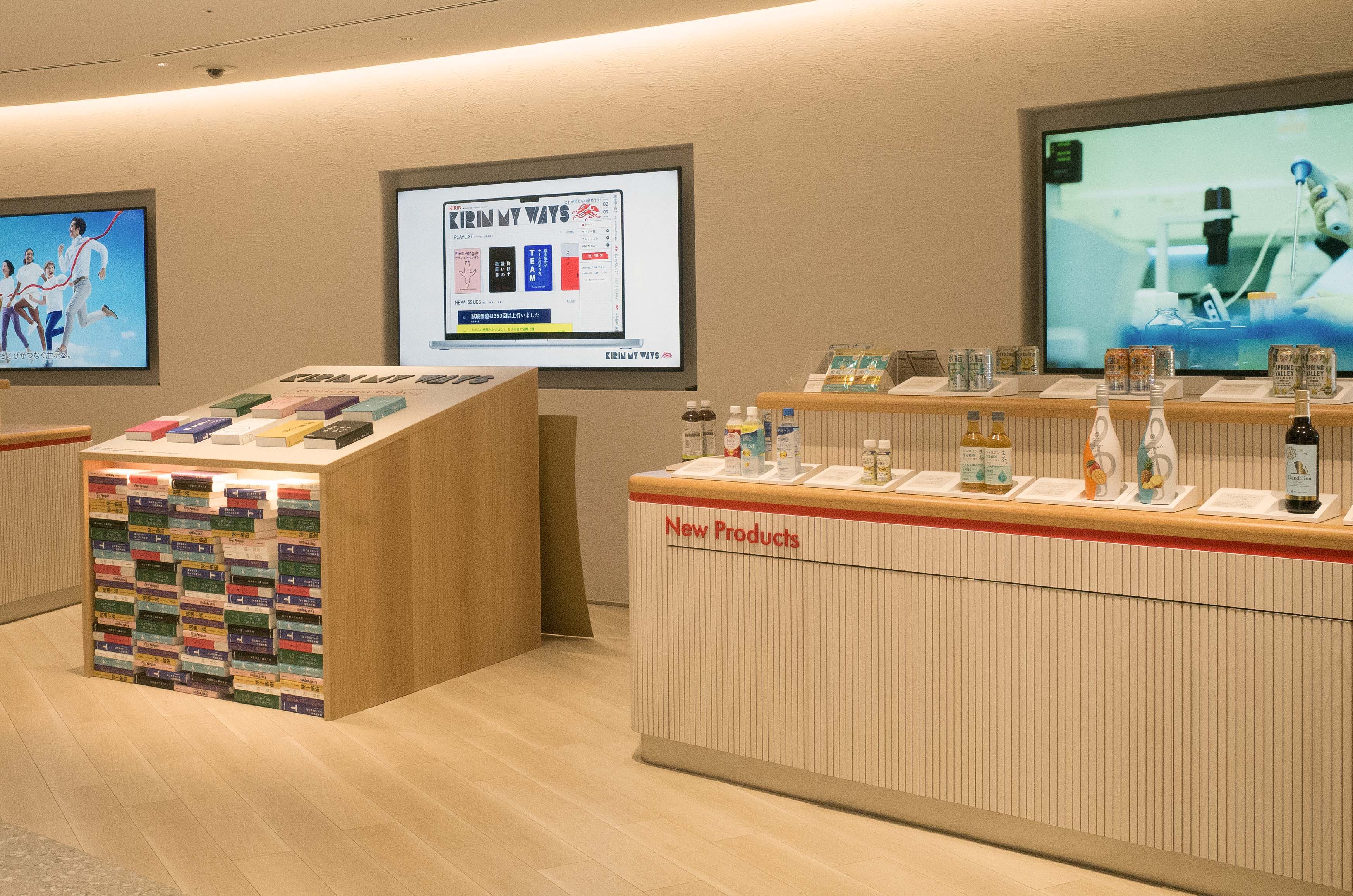 Modern retail display with screens and product showcases.