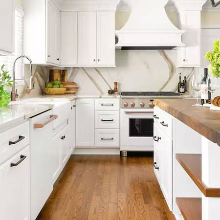 Matte white appliances in kitchen with Cambria Brittanicca Gold Countertops