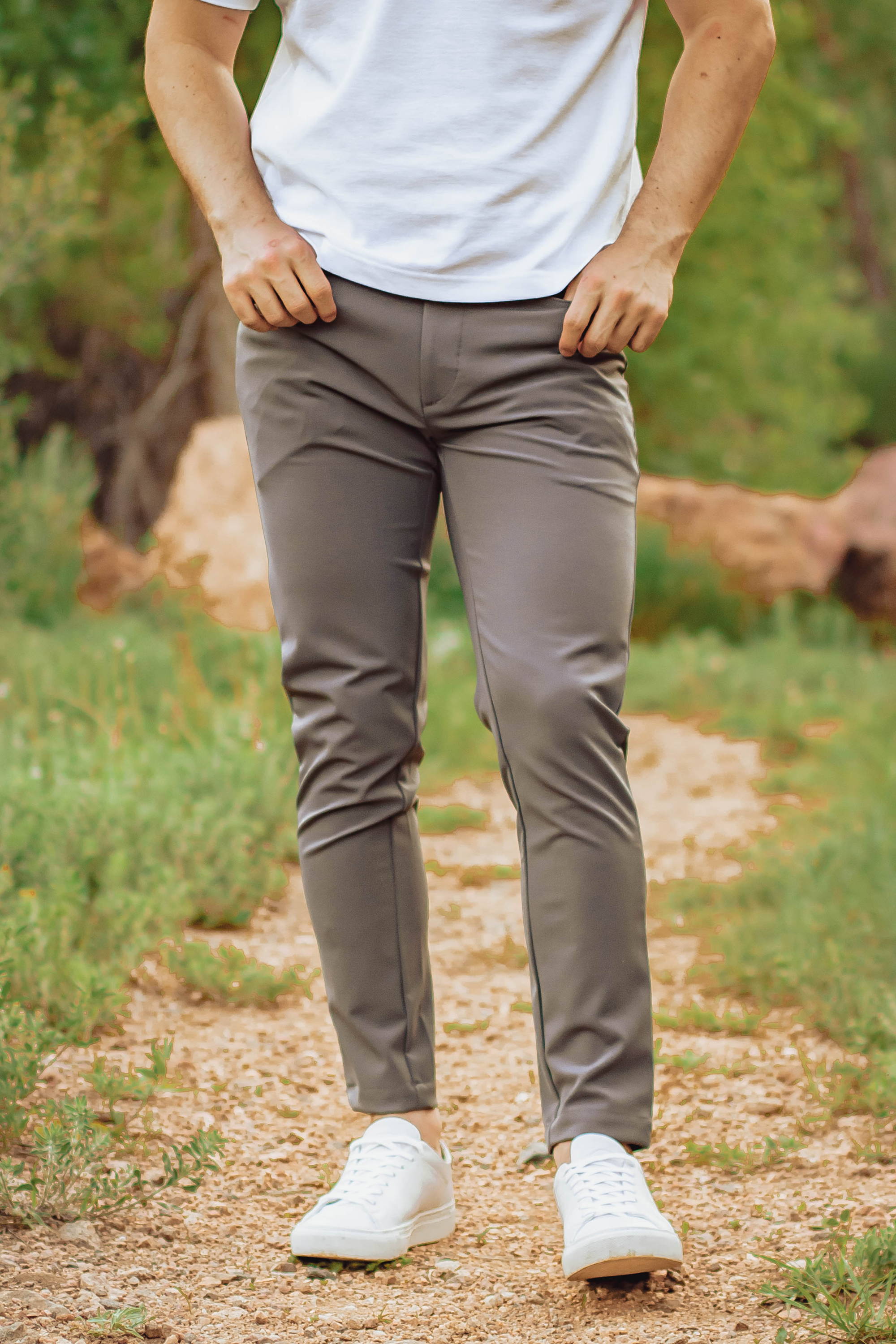 Man wearing white shoes and Gray Performance Pants from Under510.com