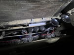 Four black horn trumpets mounted behind grille in front of radiator Trevor's 2005 Toyota 4 Runner Dixie musical horn gallery photo 5