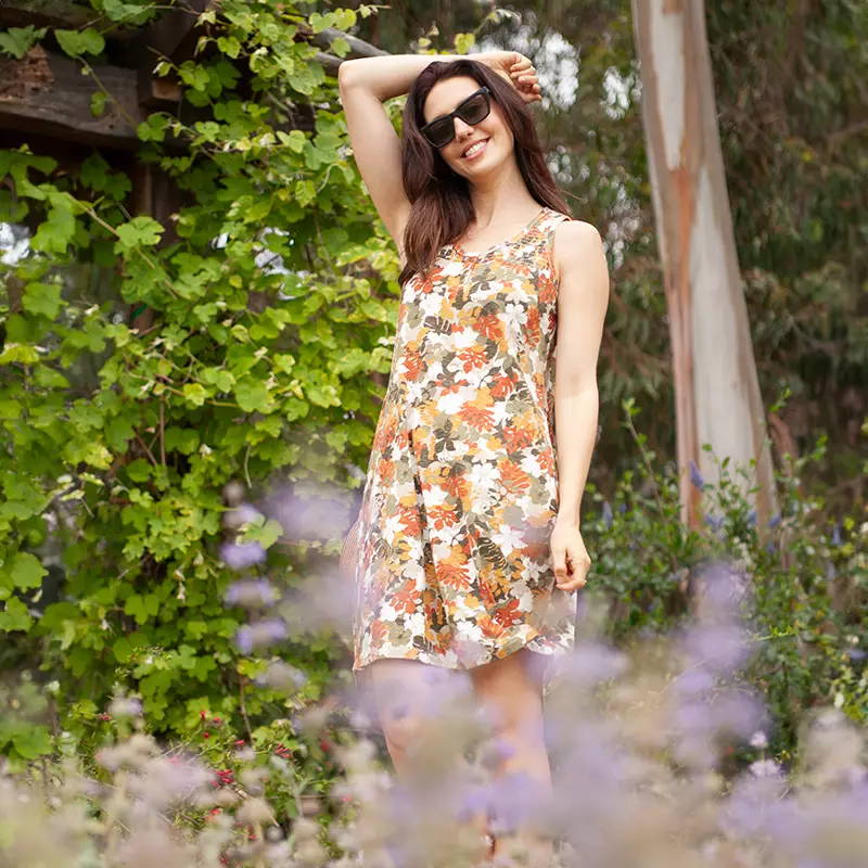 Woman wearing floral print Essex dress outside.