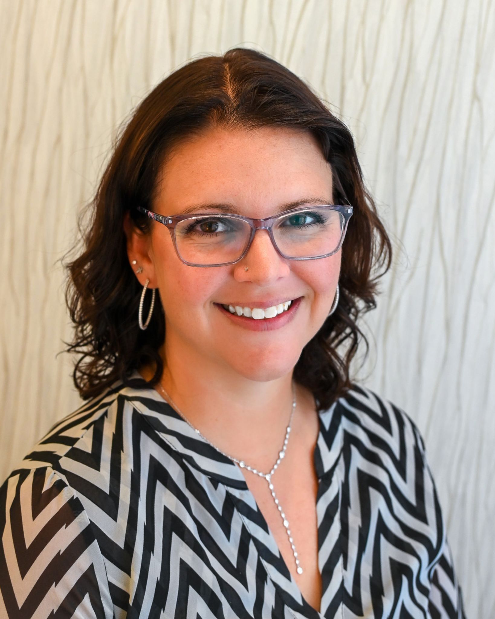 Christine Spicuzza, Marketing Manager at Henne Jewelers headshot