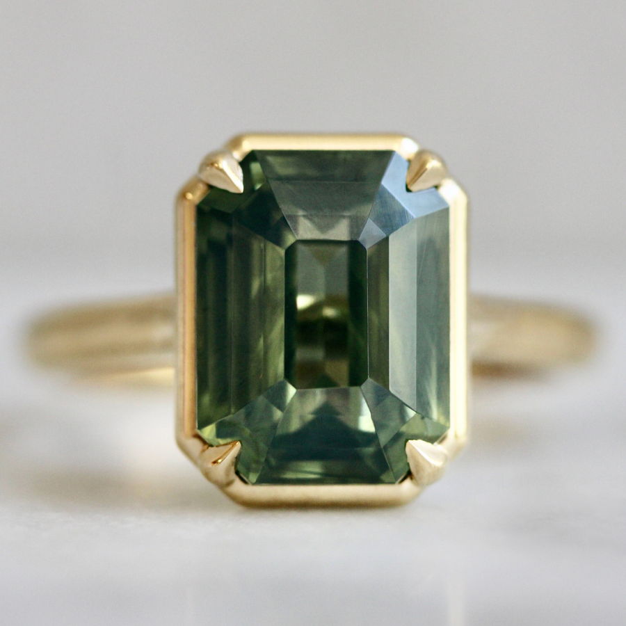 Emerald cut teal opalescent sapphire ring
