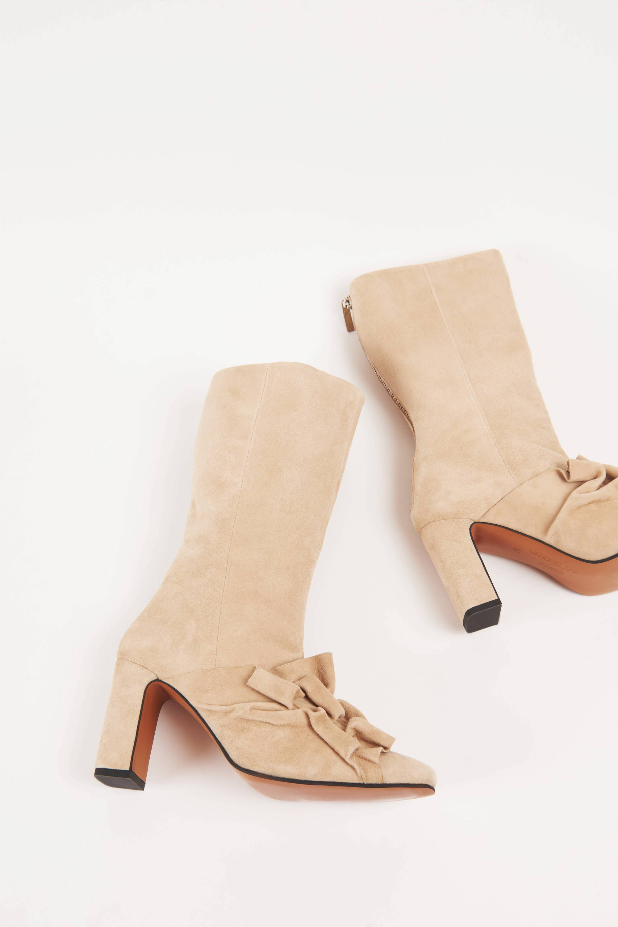 Pair of Vandrelaar Greta ankle high-heel boot in sandy beige suede with silver zip and brown sole