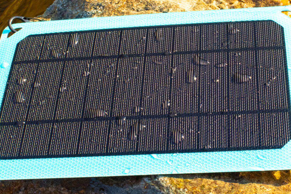Voltzy Solar with beads of water, showing off its water-resistance