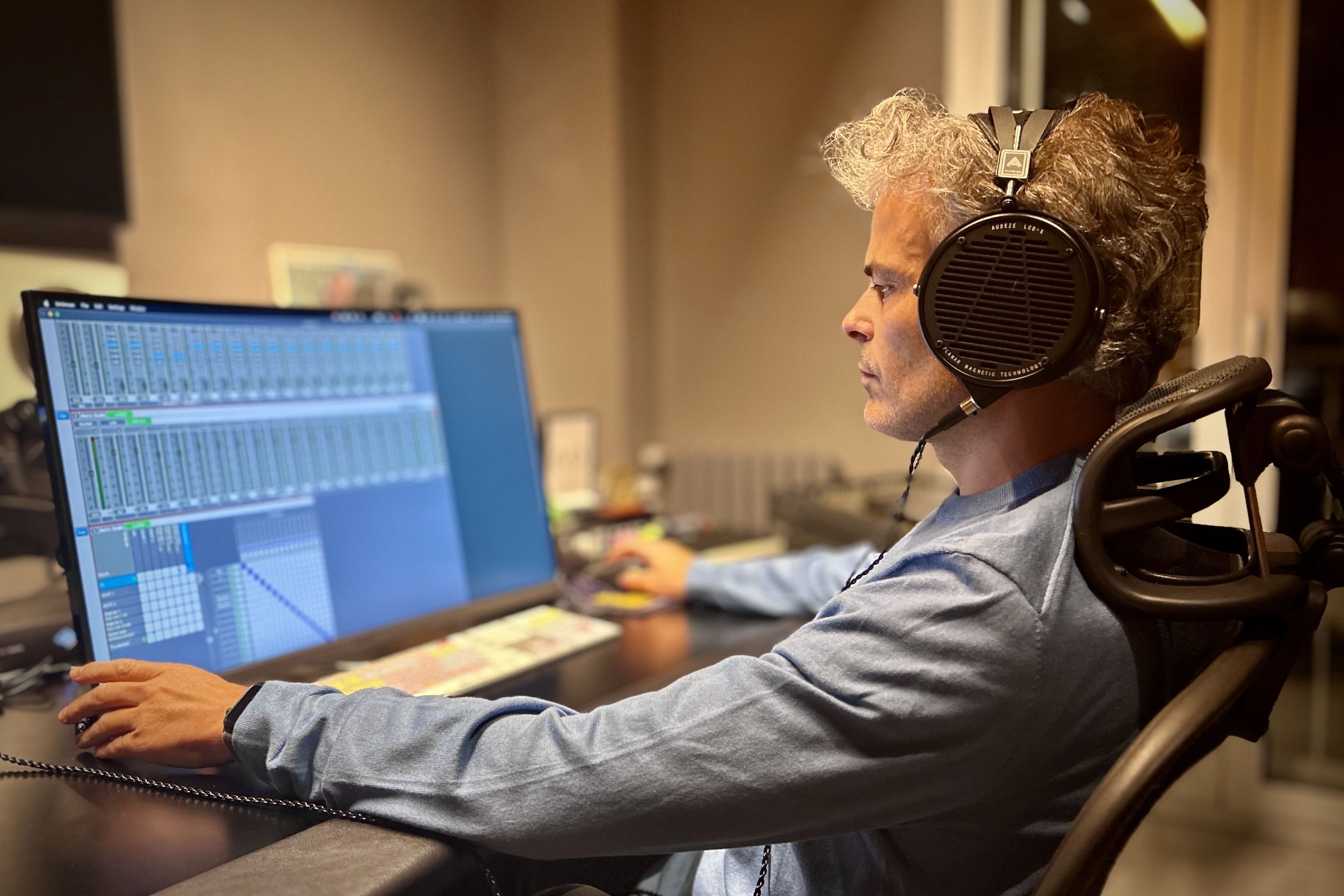 Iker Olabe wearing Audeze LCD-X headphones in the studio 