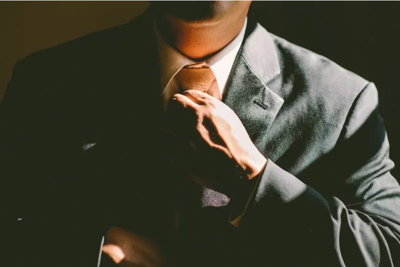 Man Holding Tie