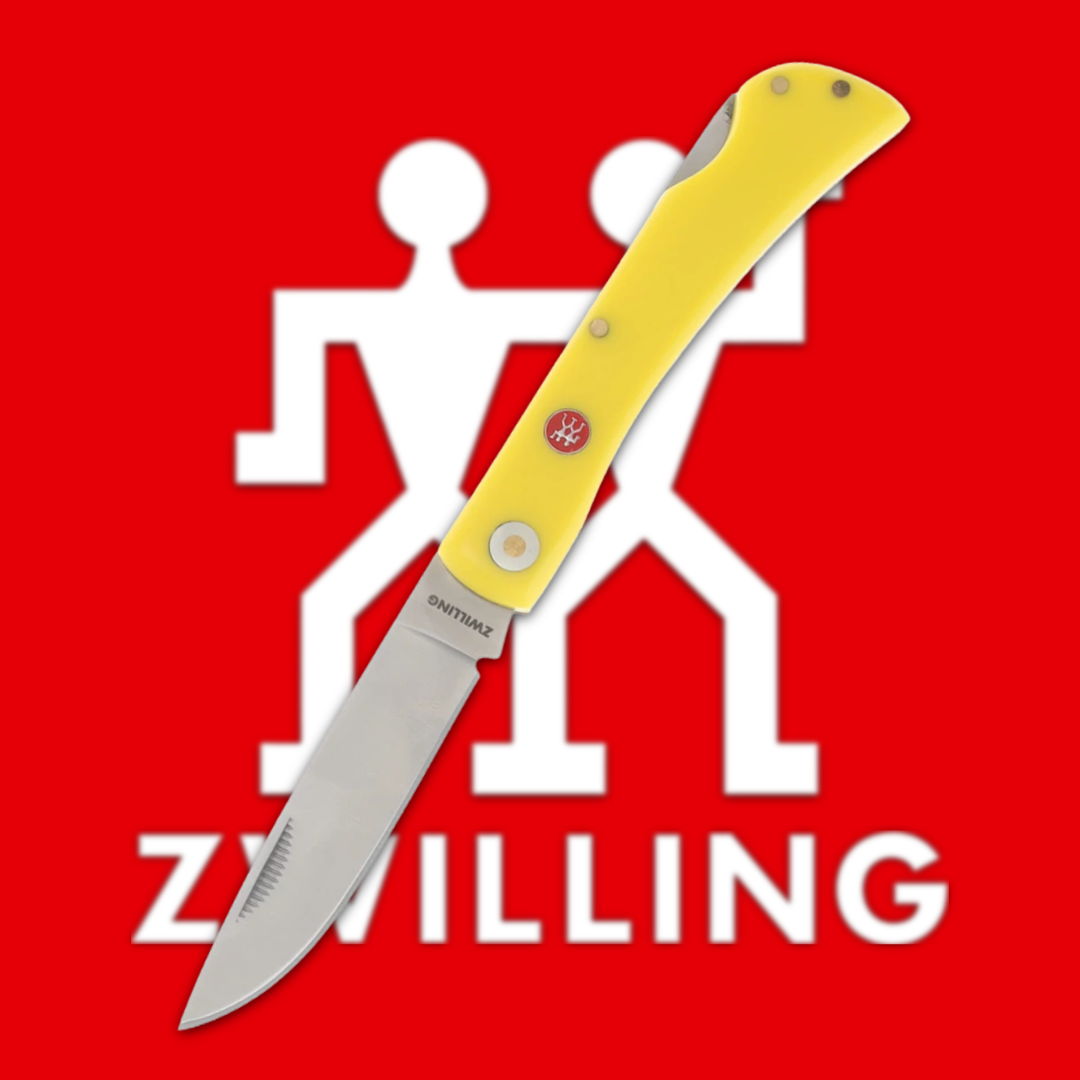 Yellow folding knife on a red background with the Zwilling logo.