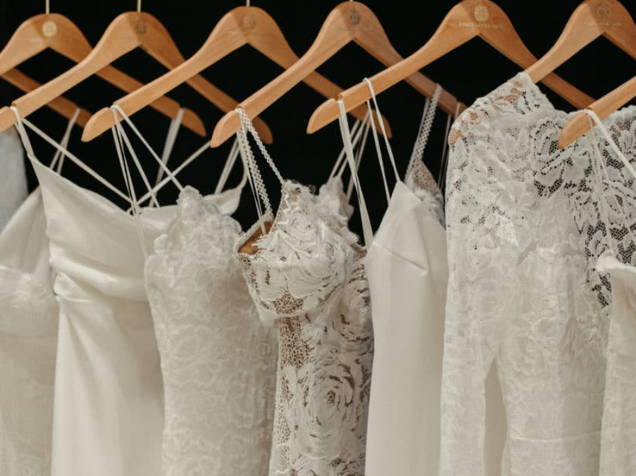 Grace Loves Lace wedding dress hanging on coat hangers