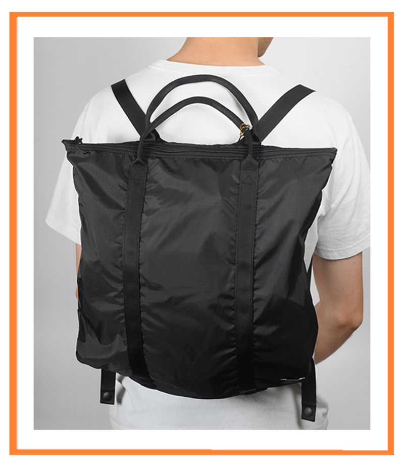 The Flex 2 Way Tote in Black worn as a Backpack.