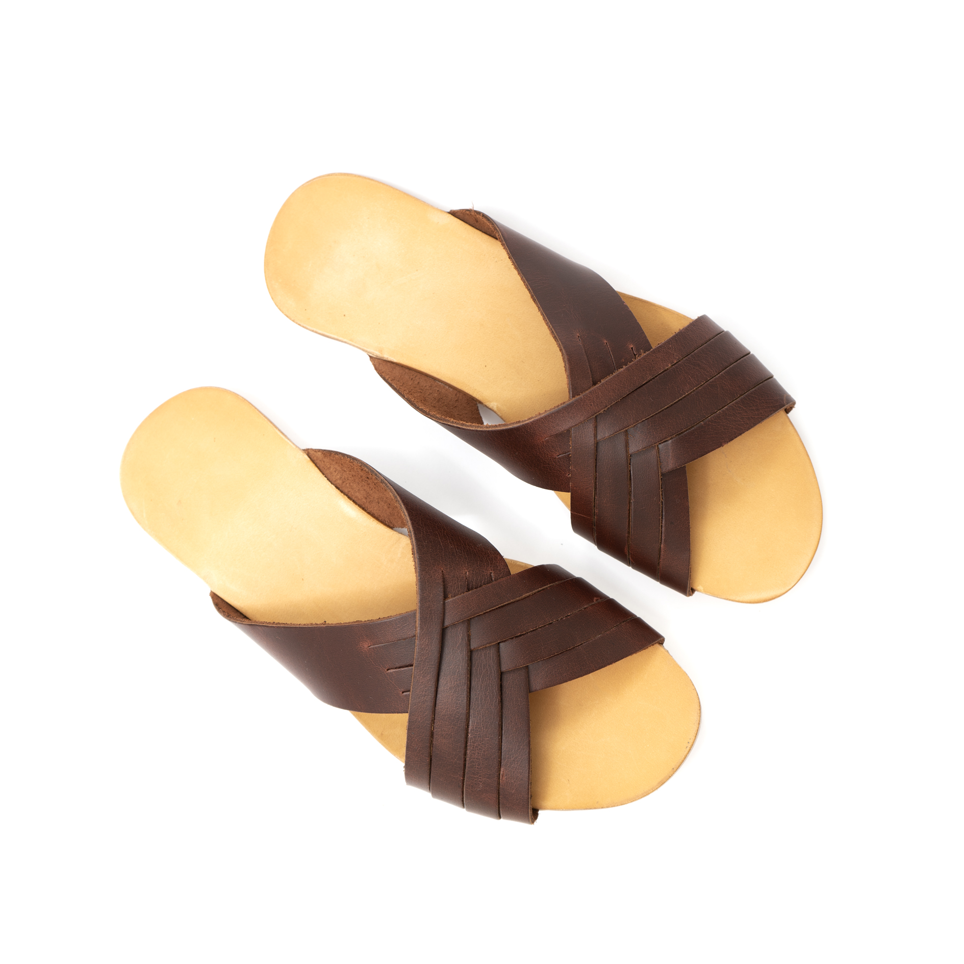 Brown woven sandals with a tan sole, viewed from above.