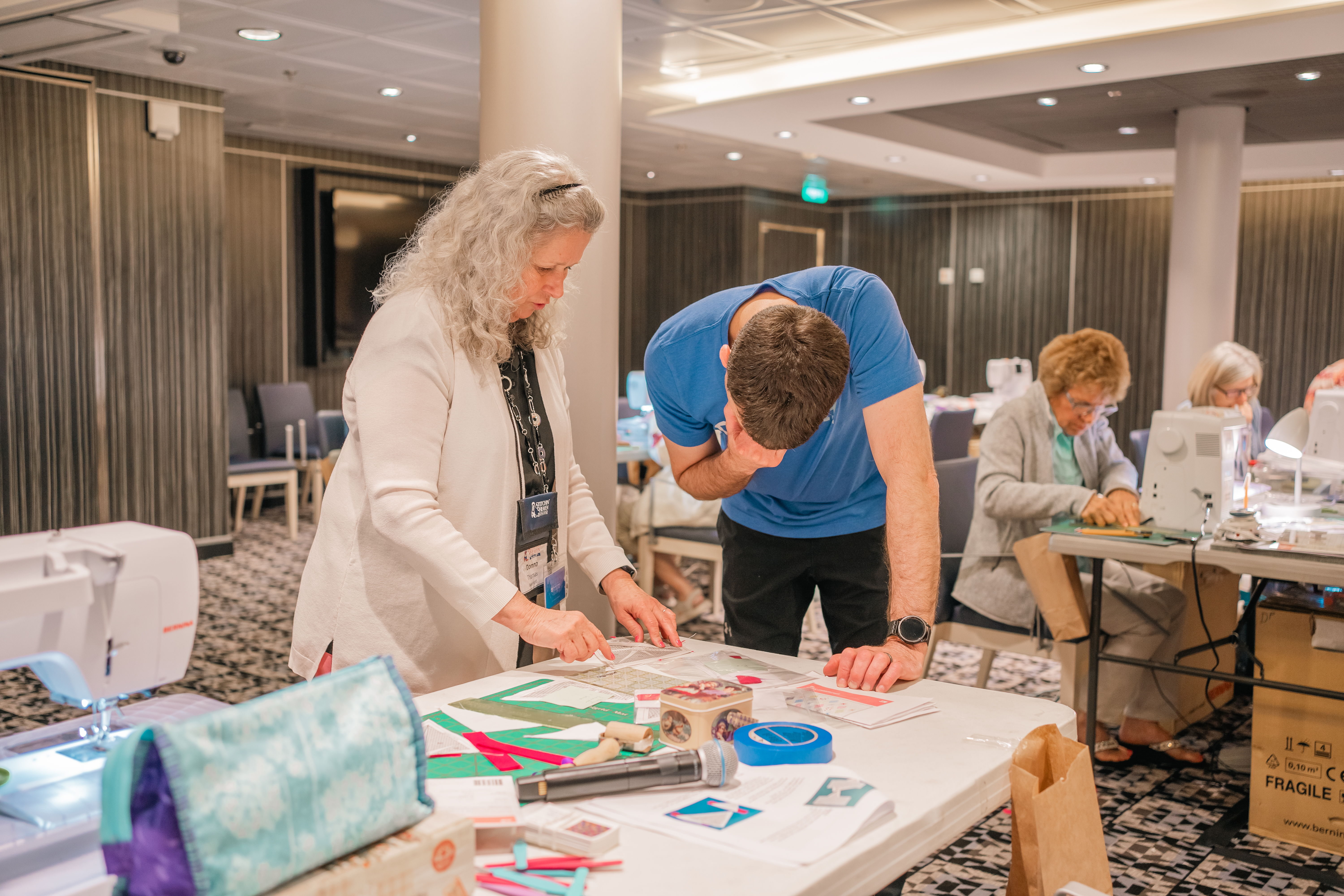 People engaged in a crafting activity at a workshop.