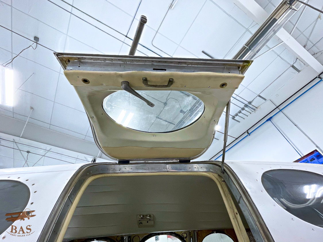 View of an aircraft's open rear hatch in a hangar.