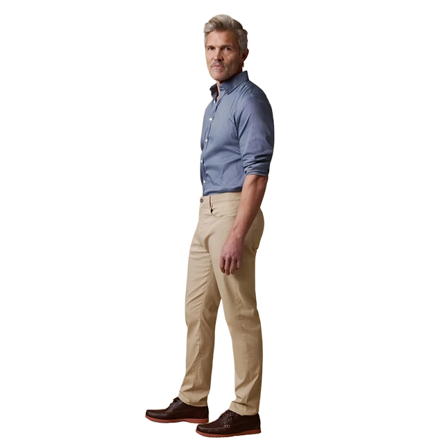 Man in a blue shirt and beige pants, standing sideways.