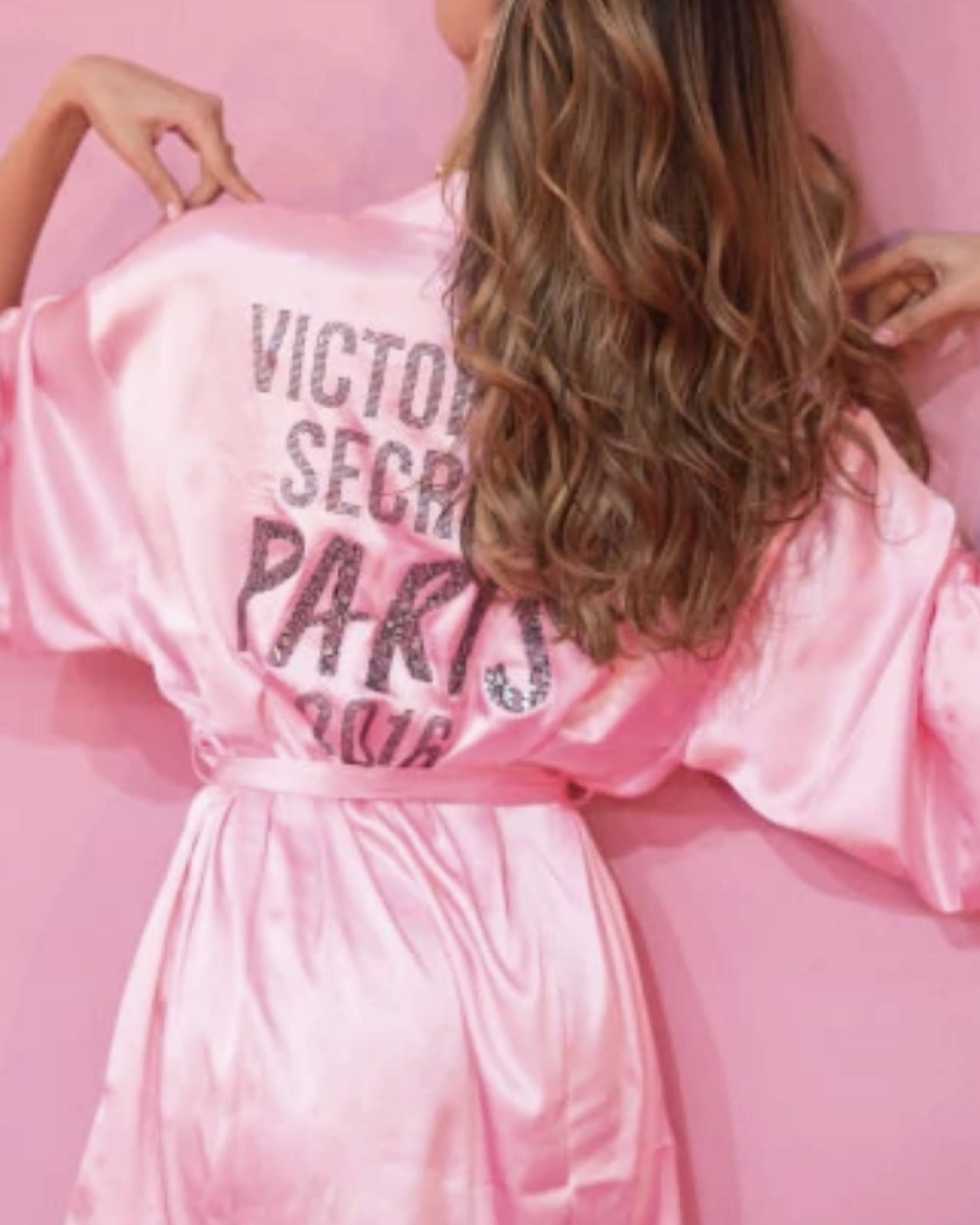 image of Victoria Secret Angel with her back to the camera showing off her pink Victoria Secret PARIS 2016