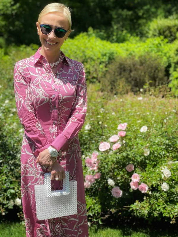 Lisa Frohlich wearing pink cotton shirt dress in The Hamptons by Ala von Auersperg