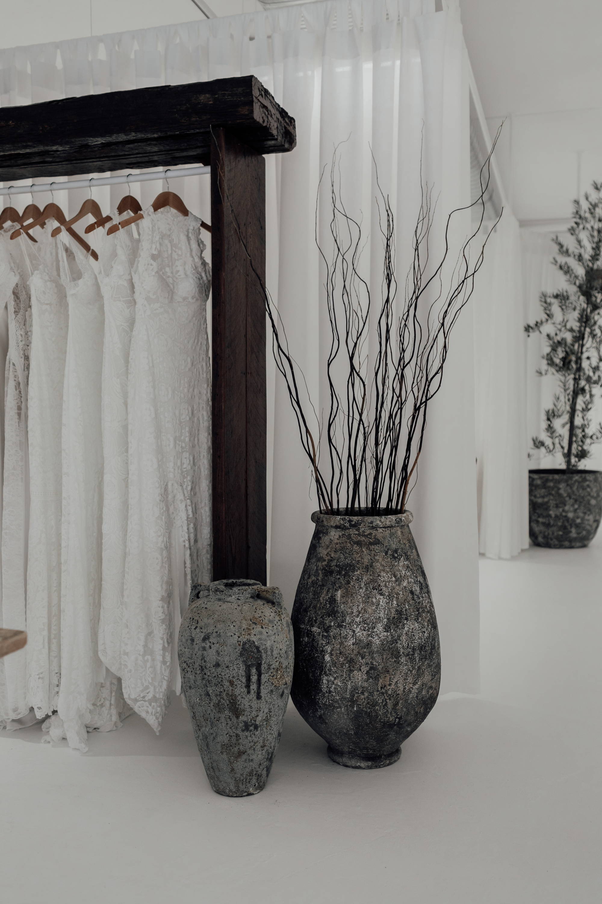 Grace Loves Lace hanging dresses and large vases