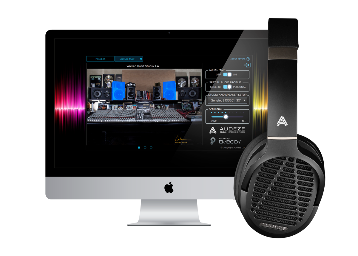 Headphones next to an iMac displaying audio mixing software.
