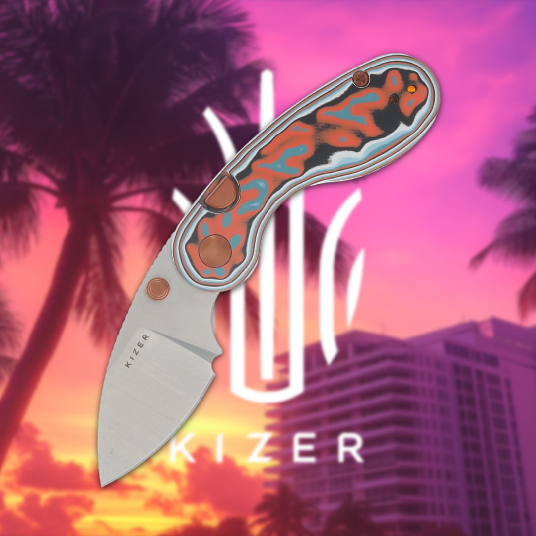 Kizer knife with colorful handle against a tropical sunset background.