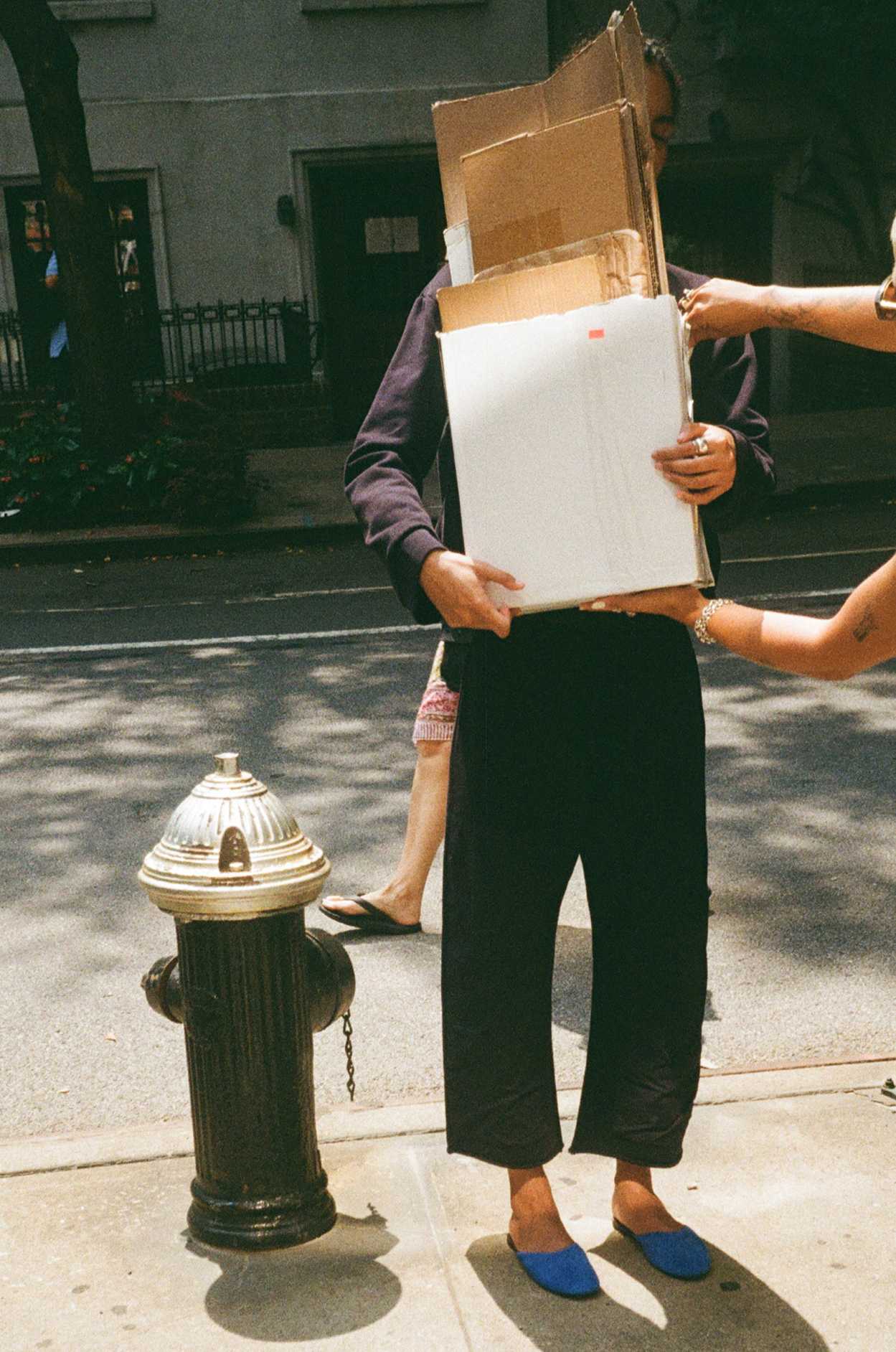 Woman carrying boxes