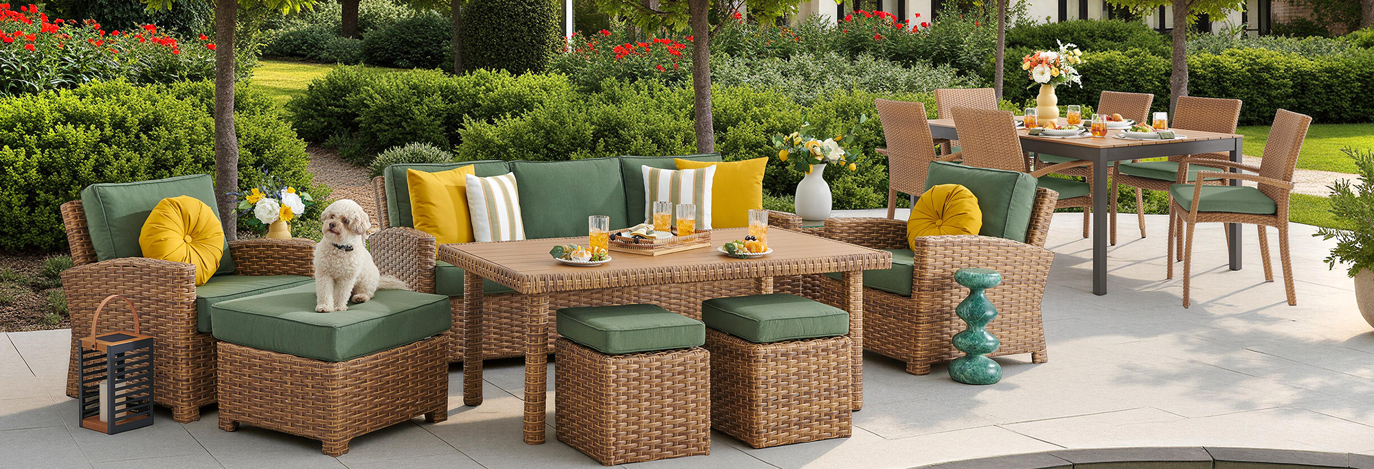 Outdoor furniture set with cushions and a dog in a garden setting.