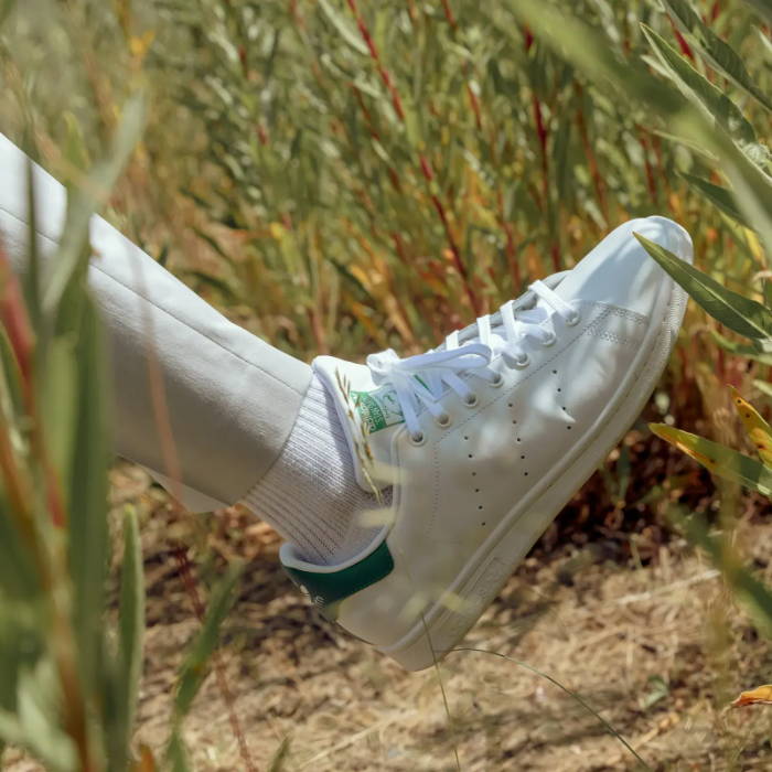 white adidas stan smiths on foot