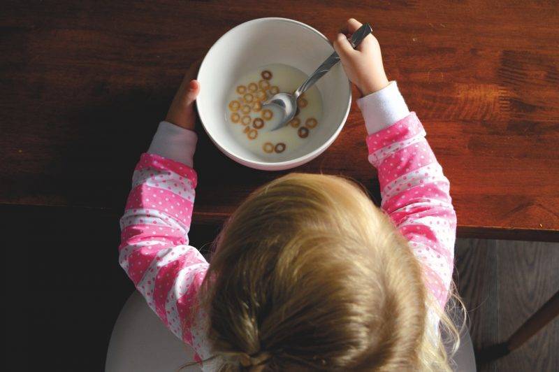 Child Eating A Bowl Of Cereal 