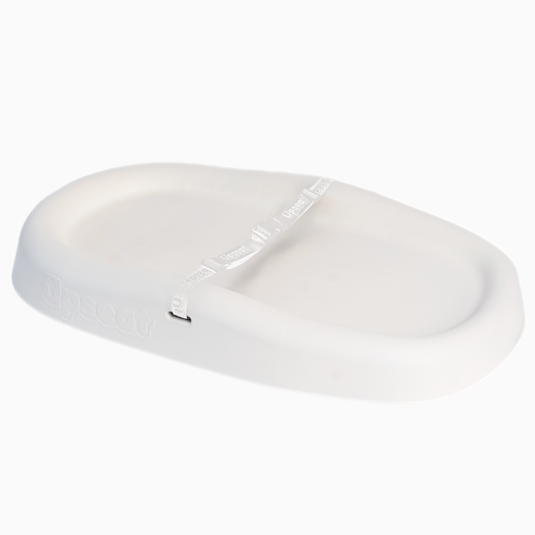 White oval-shaped lid with a handle.