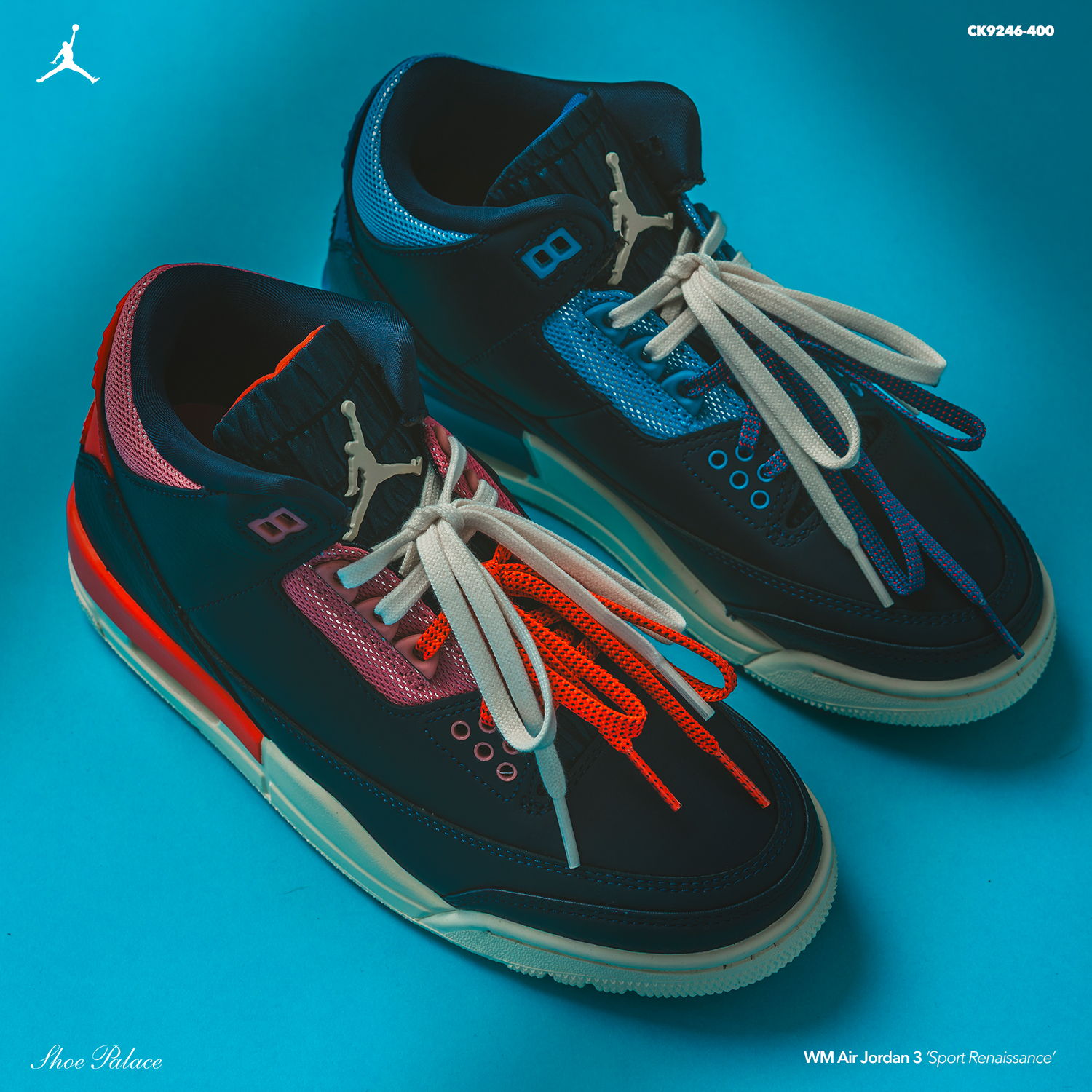 Stylish black and blue sneakers with colorful accents on a blue background.
