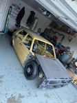 Front three-quarter view of unfinished yellow Volkswagen Rabbit Slam project in garage bodywork stage gallery photo 3