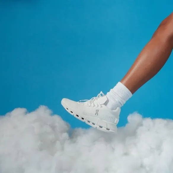 on running shoe on foot in clouds