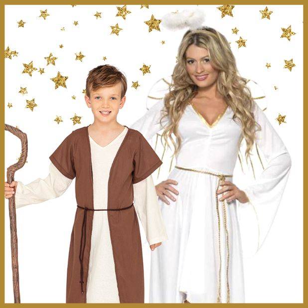 Boy dressed in a shepherds costume standing next to a lady wearing a white angel costume