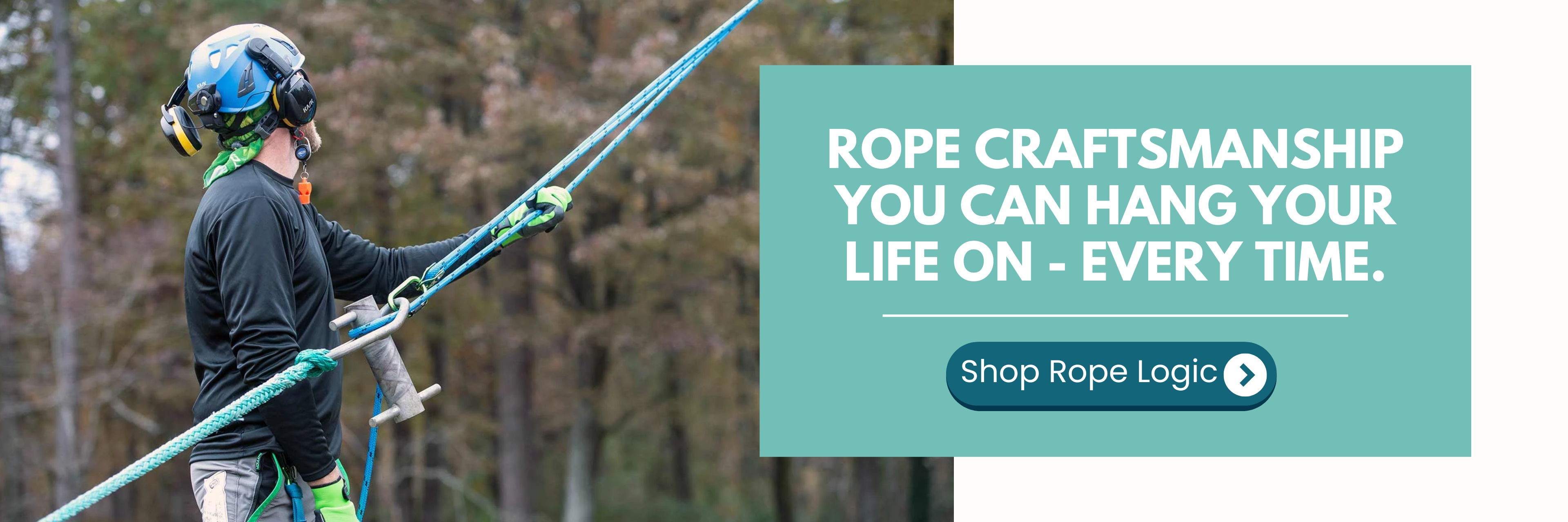 Person using rope equipment with safety gear in a forested area.