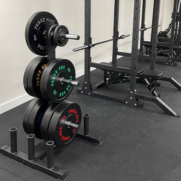 High School Gym Fit Out featuring an Olympic weightlifting area with platforms, bumper plates, and weightlifting bars.